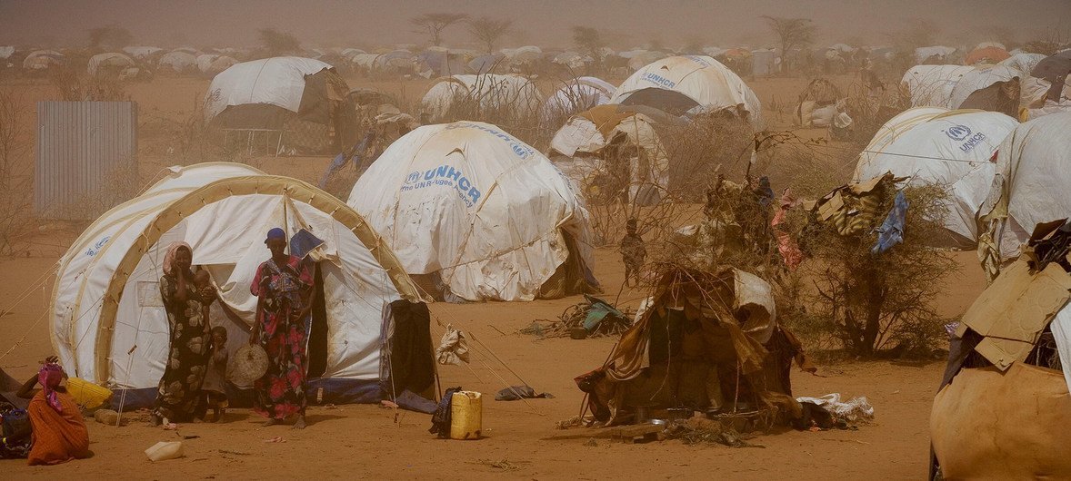 Somali women and children stand outside temporary tents in the Dagahaley refugee camp near the Kenya-Somalia border. (File) Somali women and children stand outside temporary tents in the Dagahaley refugee camp near the Kenya-Somalia border. (File)