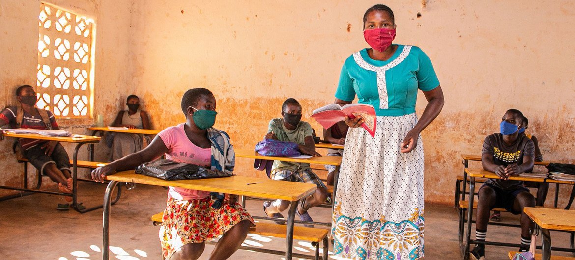 A teacher and her students wear facemasks at a primary school in Malawi.