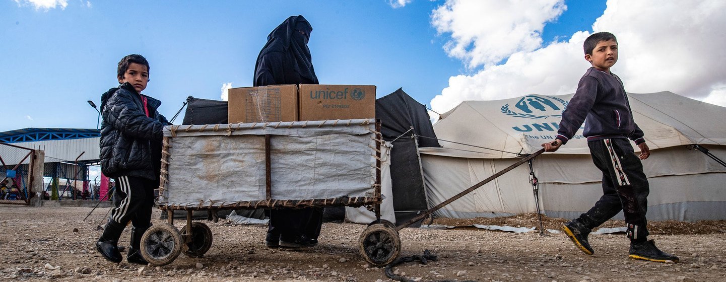 A family receives clothes for the winter from UNICEF in Al-Hol camp in northeastern Syria. A family receives clothes for the winter from UNICEF in Al-Hol camp in northeastern Syria.