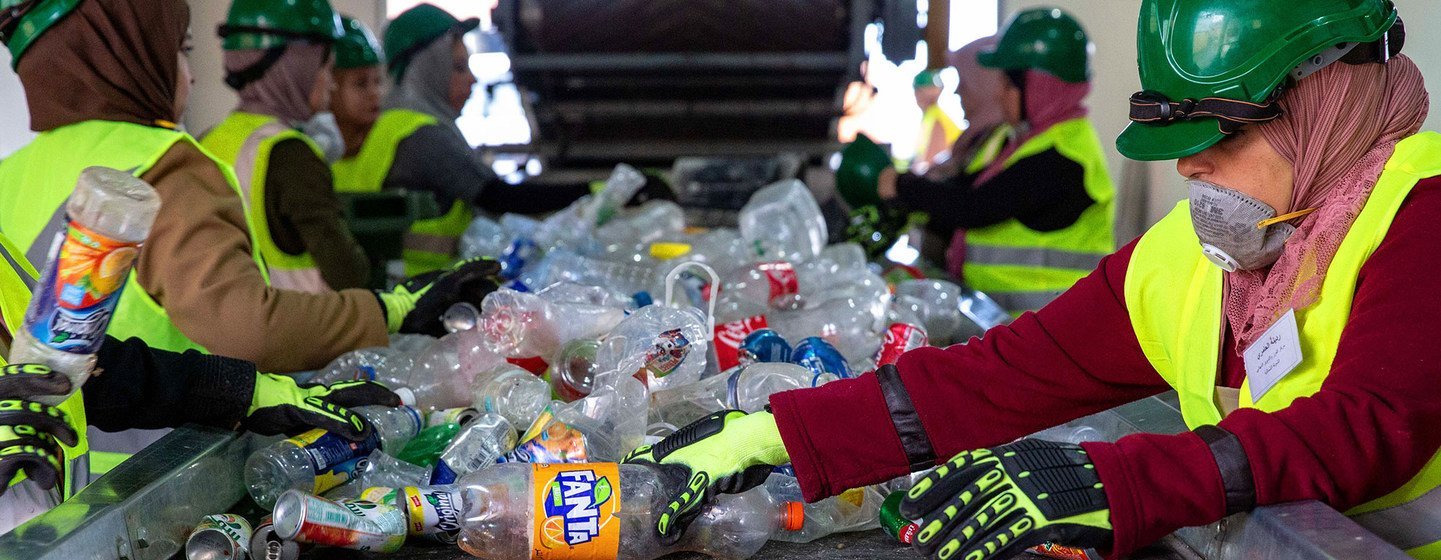 Women sort plastic at a recycling plant in Jordan.