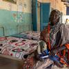 UNICEF Representative Sheldon Yett visits Damazine hospital in Blue Nile, Sudan, with a mother and child in a ward.