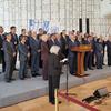 A group of UN Ambassadors stands on a stage at the UN Office in Geneva for a joint press conference.