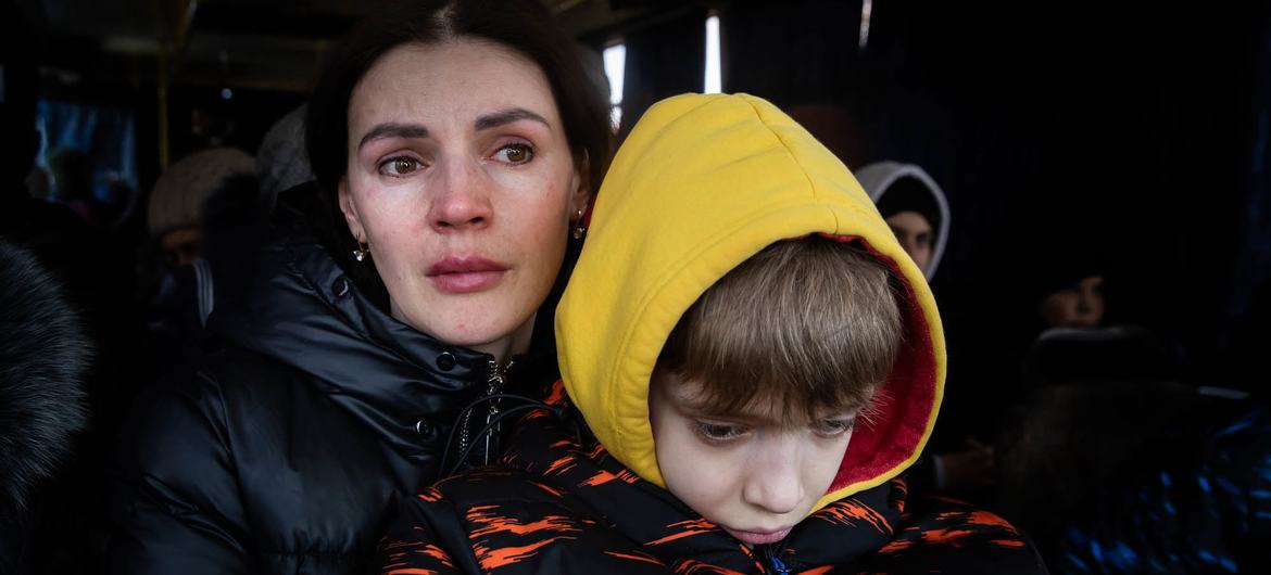 A mother and her son wait to be evacuated from the besieged city of Mikolayiv in Ukraine in March 2022. A mother and her son wait to be evacuated from the besieged city of Mikolayiv in Ukraine in March 2022.
