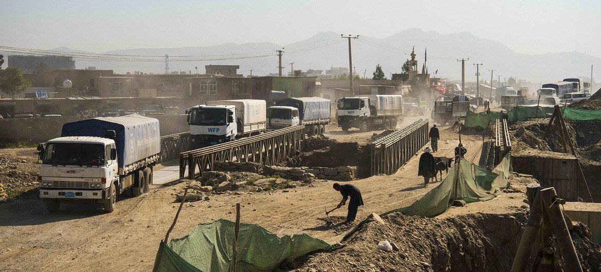 Trucks from the UN's World Food Programme leave Kabul in May 2021 to deliver food to vulnerable communities. Trucks from the UN's World Food Programme leave Kabul in May 2021 to deliver food to vulnerable communities.