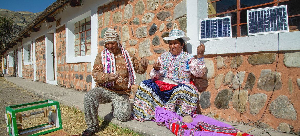 Villagers in the Peruvian village of Sibayo, use a solar-powered spinning machine. Villagers in the Peruvian village of Sibayo, use a solar-powered spinning machine.