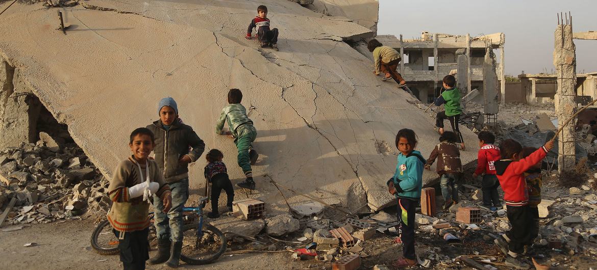 Children play on a destroyed building in east Ghouta in Syria. Children play on a destroyed building in east Ghouta in Syria.