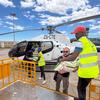 Staff from UNOCHA and partners load food aid into a helicopter at an airport in Xai Xai, Mozambique, to deliver assistance to flood victims.