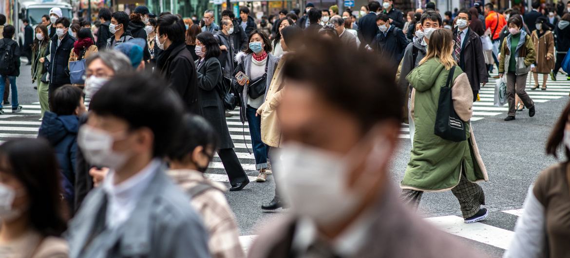People wear protective masks in Tokyo, Japan.