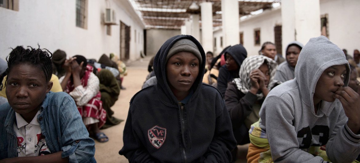 Migrants from Nigeria who were rescued by the Libyan Coast Guard as their boat was capsizing, crouch in a courtyard at a detention centre, where they are being held, in Libya. (file) Migrants from Nigeria who were rescued by the Libyan Coast Guard as their boat was capsizing, crouch in a courtyard at a detention centre, where they are being held, in Libya. (file)