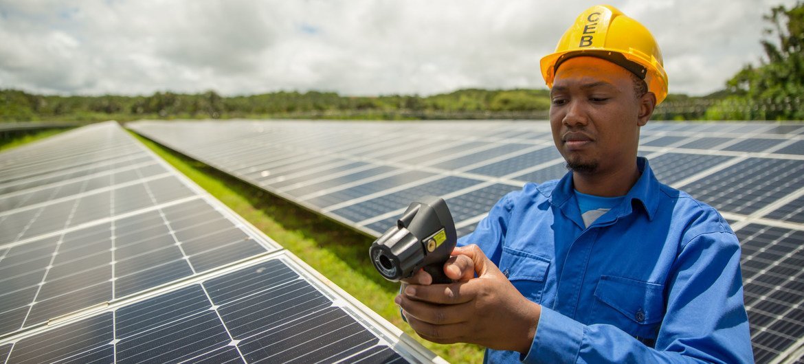 Solar panels are maintained at a farm in Mauritius. Solar panels are maintained at a farm in Mauritius.