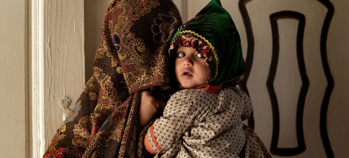 A mother and her child inside a medical clinic in Kandahar, Afghanistan. A mother and her child inside a medical clinic in Kandahar, Afghanistan.
