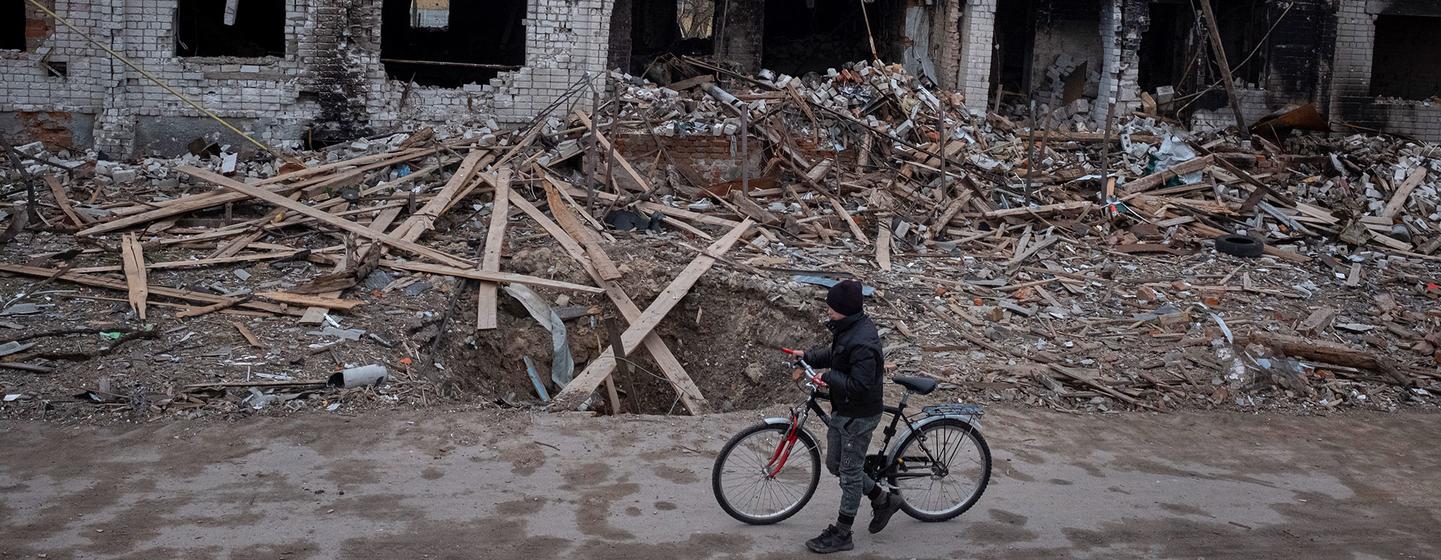 A boy walks past destroyed houses near his home in Novoselivka, on the outskirts of Chernihiv in Ukraine. A boy walks past destroyed houses near his home in Novoselivka, on the outskirts of Chernihiv in Ukraine.
