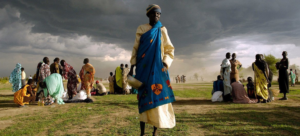 An elderly woman, internally displaced from her home in Abyei in Sudan, gets ready to receive her ration of emergency food aid. An elderly woman, internally displaced from her home in Abyei in Sudan, gets ready to receive her ration of emergency food aid.