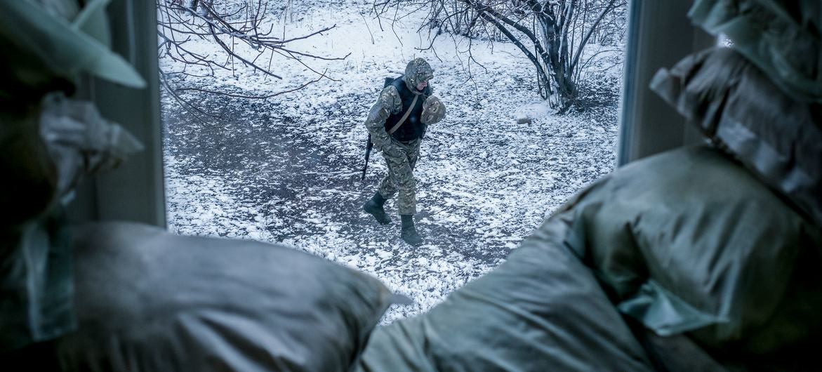 An armed police officer patrols outside a classroom in Donetsk Oblast, Ukraine. (File) An armed police officer patrols outside a classroom in Donetsk Oblast, Ukraine. (File)