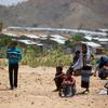 Children, including Eritrean refugees, wait in the Hitsats refugee camp in Ethiopia.