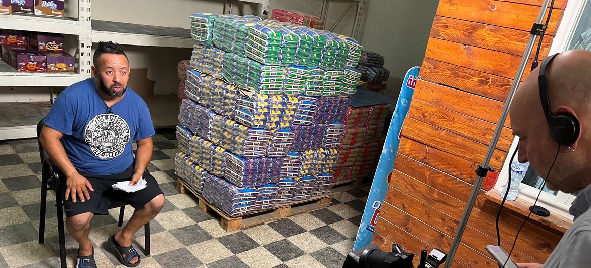 Wholesaler Walid Khalfawi talks with UN News at local grocery store in Tunis, Tunisia.