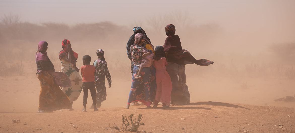 Women and children in a sandstorm in the Somali region of Ethiopia. Women and children in a sandstorm in the Somali region of Ethiopia.