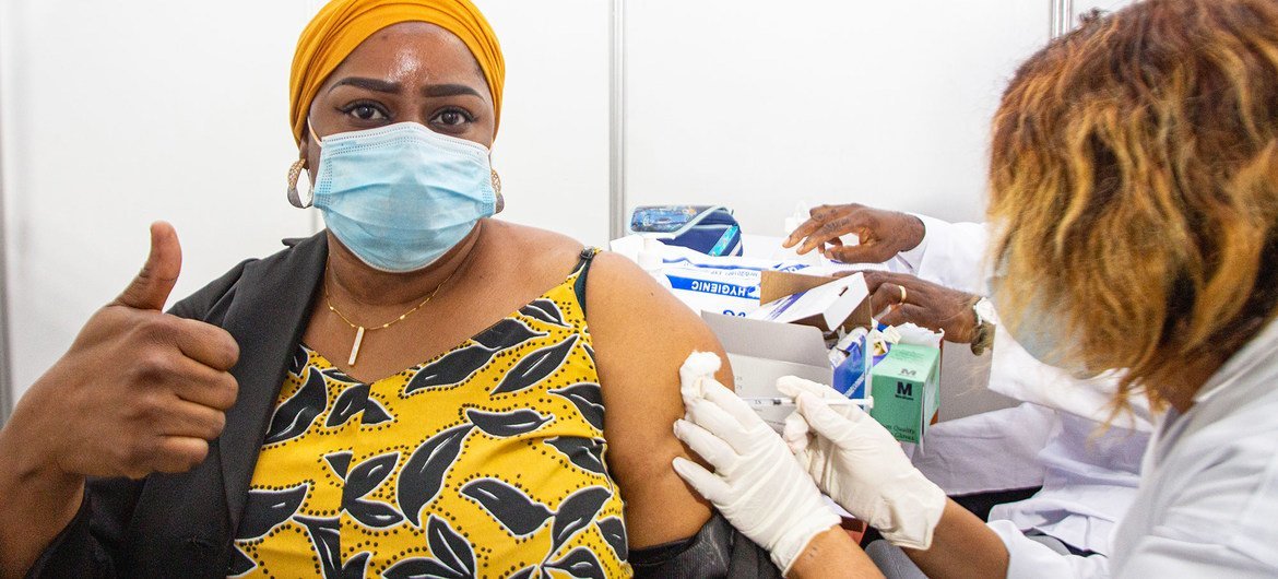 A health worker in Abidjan, Côte d'Ivoire, becomes one of the first people to receive the COVID-19 vaccine as part of the global rollout of COVAX in Africa.