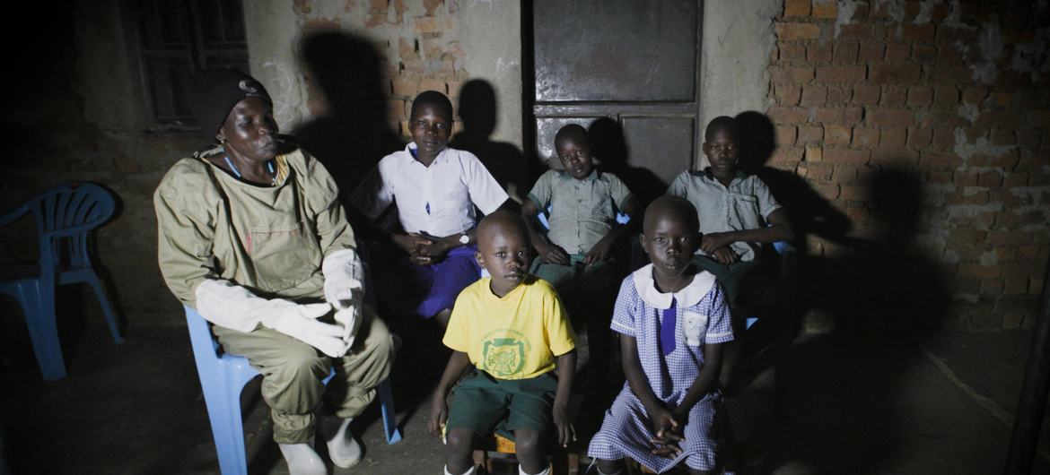 Beekeeper Betty Ayikoru and her family at their home in Arua, northern Uganda