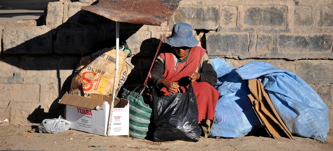 A homeless woman sits by a railway track in Potosí, Bolivia. A homeless woman sits by a railway track in Potosí, Bolivia.