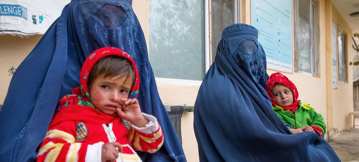Women wait for their children to be screened for malnutrition at a clinic in Balkh Province, Afghanistan. Women wait for their children to be screened for malnutrition at a clinic in Balkh Province, Afghanistan.