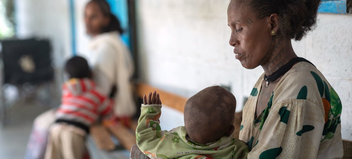 A mother holds her one-year-old son, who is suffering from malnutrition, at a health centre in the Tigray region of northern Ethiopia. A mother holds her one-year-old son, who is suffering from malnutrition, at a health centre in the Tigray region of northern Ethiopia.