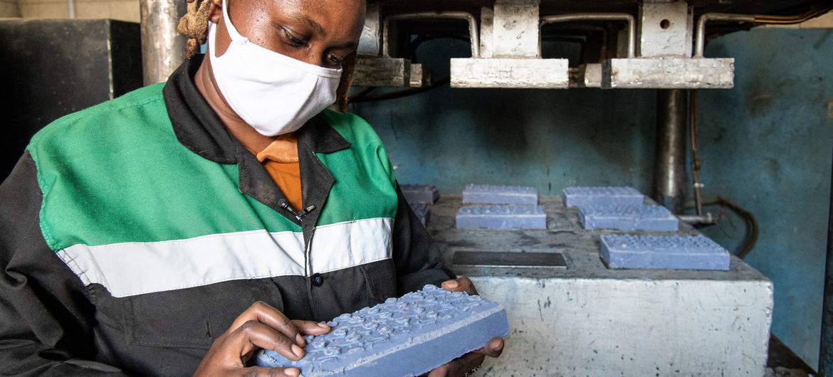UNEP Young Champion of the Earth winner, Nzambi Matee, at her workshop where she turns plastic waste into bricks. UNEP Young Champion of the Earth winner, Nzambi Matee, at her workshop where she turns plastic waste into bricks.