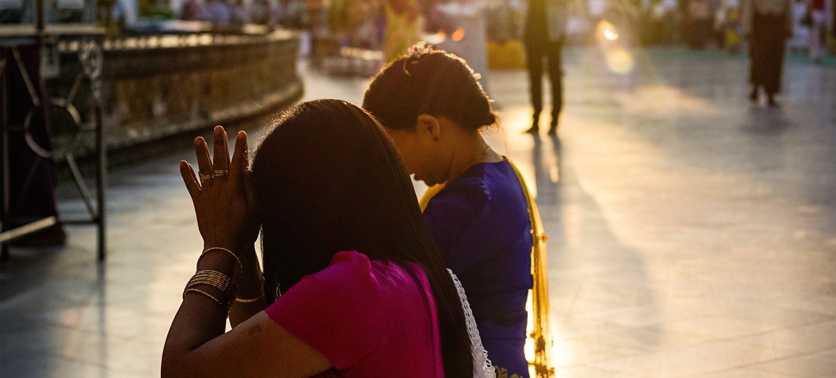People praying in the grounds of a temple in Yangon, Myanmar, the country's largest city. People praying in the grounds of a temple in Yangon, Myanmar, the country's largest city.