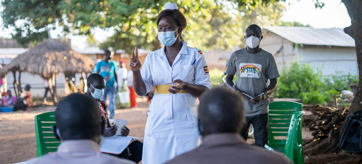 Judith Candiru, an Assistant Nursing Officer in Yumbe district Uganda, provides COVID-19 vaccination services within the community of Midigo. Judith Candiru, an Assistant Nursing Officer in Yumbe district Uganda, provides COVID-19 vaccination services within the community of Midigo.