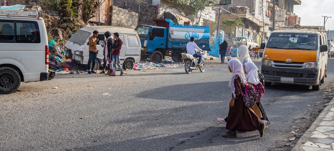 Young girls cross the road on their way to school in Taizz, Yemen. Young girls cross the road on their way to school in Taizz, Yemen.