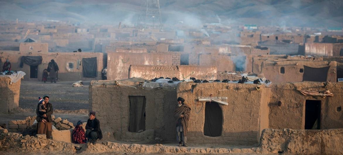 Smoke rises from the chimneys of houses in a camp for displaced people during a harsh winter in Afghanistan. Smoke rises from the chimneys of houses in a camp for displaced people during a harsh winter in Afghanistan.