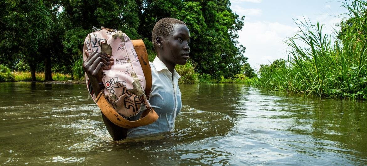 A girl walks home from school after the Nile river flooded on the outskirts of Juba, South Sudan. A girl walks home from school after the Nile river flooded on the outskirts of Juba, South Sudan.