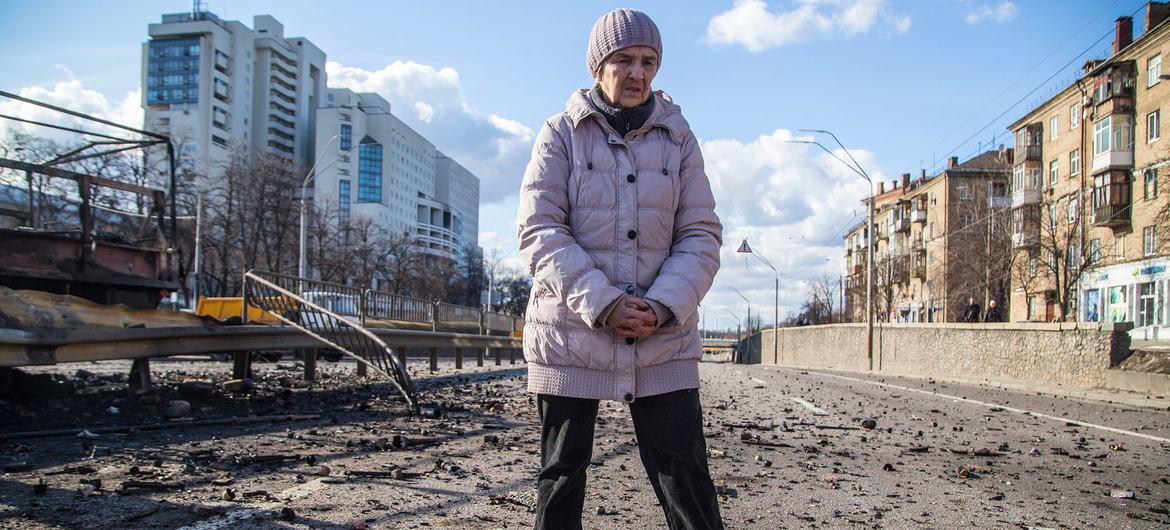 A woman stands in debris caused by shelling in Beresteisk in Kyiv, Ukraine. A woman stands in debris caused by shelling in Beresteisk in Kyiv, Ukraine.