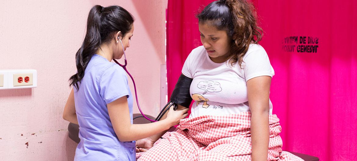 In Guatemala, a nurse monitors a 16-year-old girl who has gone into labour. In Guatemala, a nurse monitors a 16-year-old girl who has gone into labour.