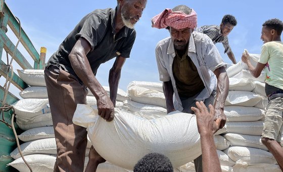 Food is unloaded from a truck at a WFP distribution site in Zelazle in the north of Tigray. Food is unloaded from a truck at a WFP distribution site in Zelazle in the north of Tigray.