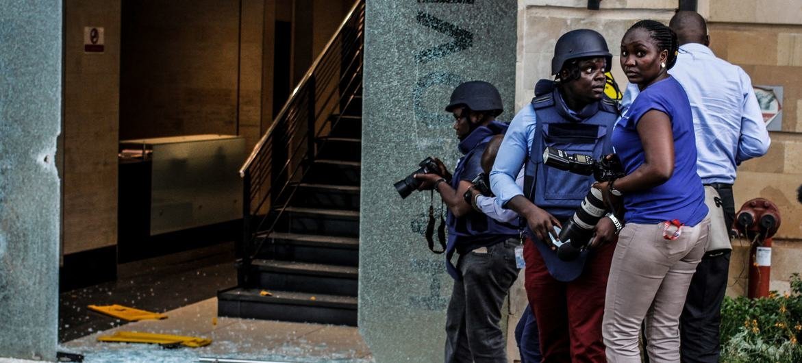 Journalists covering a terrorist attack in Kenya. Journalists covering a terrorist attack in Kenya.
