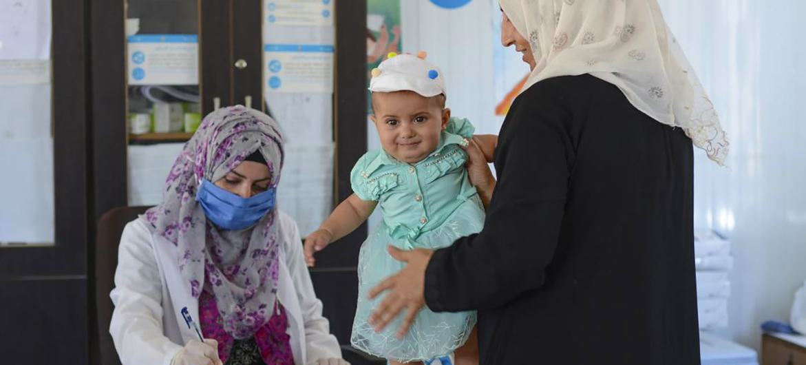 A woman brings her eight-month-old granddaughter for a check-up at a health clinic in northern rural Hama in Syria. A woman brings her eight-month-old granddaughter for a check-up at a health clinic in northern rural Hama in Syria.