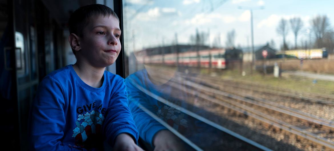 A six-year-old boy rides in a train along the Poland-Ukrainian border in Medyka, after fleeing the conflict in Ukraine with his mother. A six-year-old boy rides in a train along the Poland-Ukrainian border in Medyka, after fleeing the conflict in Ukraine with his mother.