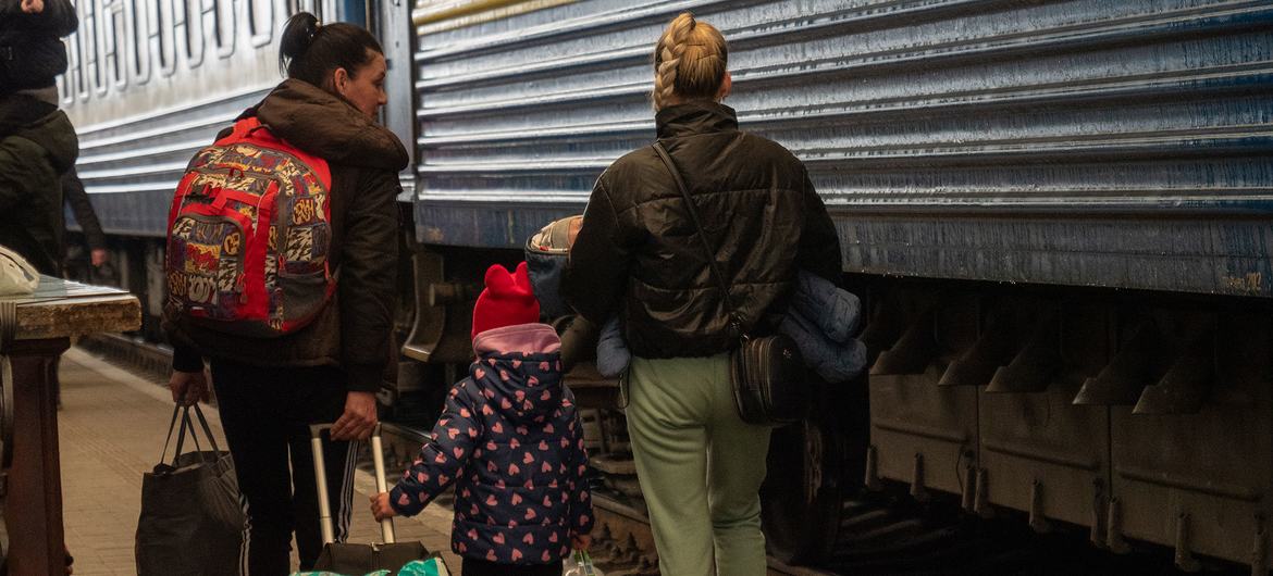 Women and children board evacuation trains at Lviv railway station in Ukraine. Women and children board evacuation trains at Lviv railway station in Ukraine.
