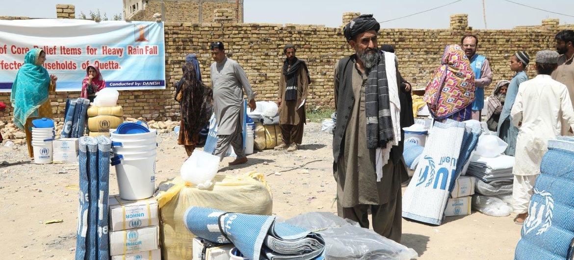 Flood victims collect emergency supplies in Balochistan province, southwestern Pakistan. Flood victims collect emergency supplies in Balochistan province, southwestern Pakistan.