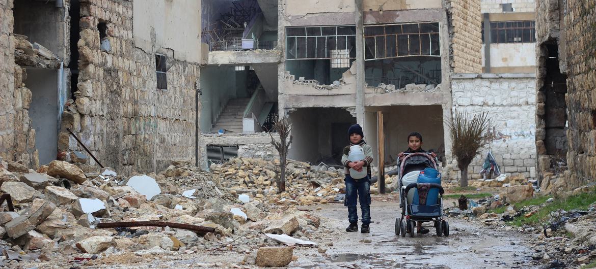 In east Aleppo in Syria, two boys collect water for their family. (file) In east Aleppo in Syria, two boys collect water for their family. (file)