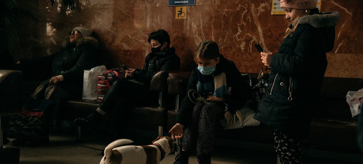 A family at Kramatorsk rail station in Ukraine waits for an evacuation train to Kyiv. A family at Kramatorsk rail station in Ukraine waits for an evacuation train to Kyiv.