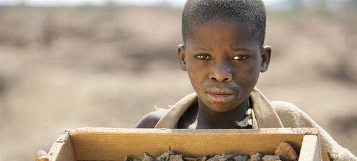 A boy mines for copper mine in the town of Kipushi in southeastern Democratic Republic of the Congo.