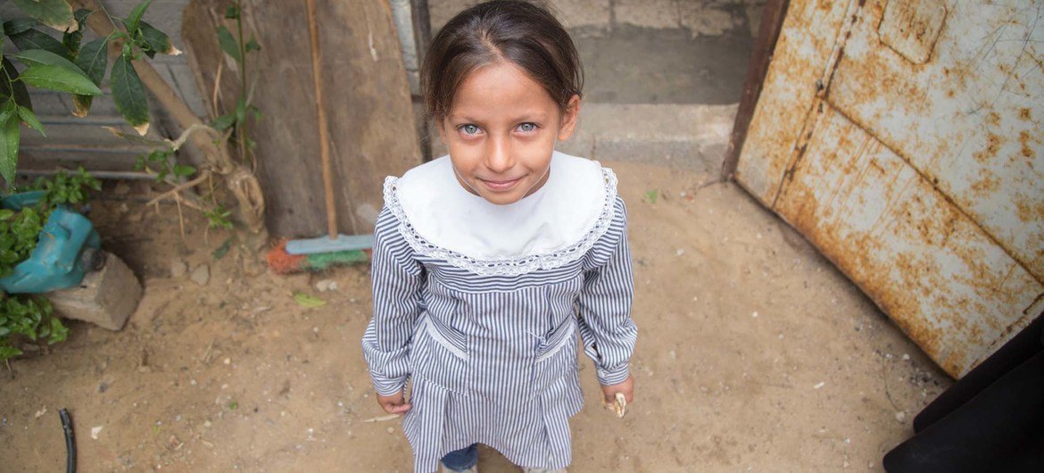 A girl stands in front of her home in Khan Younis Palestine refugee camp in Gaza. A girl stands in front of her home in Khan Younis Palestine refugee camp in Gaza.