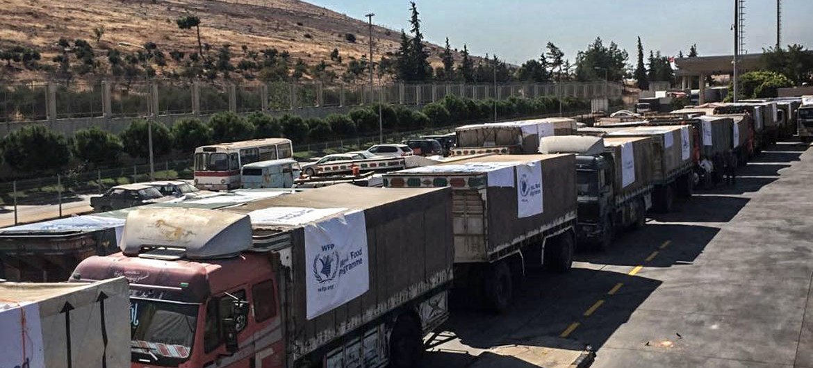 Trucks carrying food assistance cross the Turkish border into Syria. (file photo)