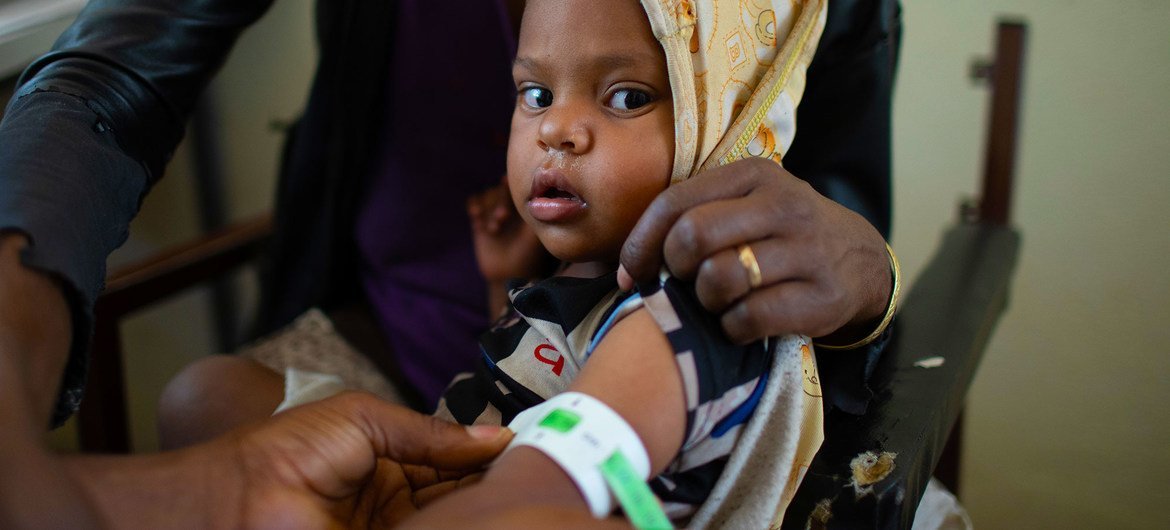 A child is screened for malnutrition at a health centre in Tigray, Ethiopia. A child is screened for malnutrition at a health centre in Tigray, Ethiopia.