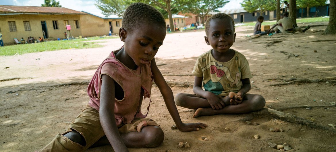 Children displaced by violence play in a school yard in eastern Democratic Republic of the Congo. Children displaced by violence play in a school yard in eastern Democratic Republic of the Congo.