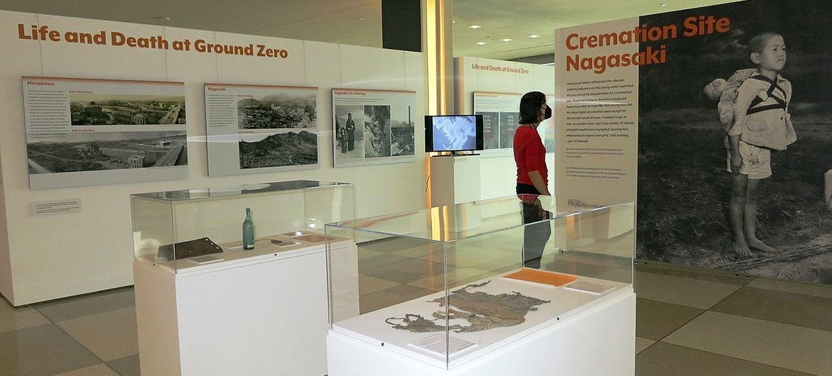 At a disarmament exhibition in UN Headquarters in New York, a visitor reads text about a young boy bringing his little brother to a cremation site in Nagasaki, Japan. At a disarmament exhibition in UN Headquarters in New York, a visitor reads text about a young boy bringing his little brother to a cremation site in Nagasaki, Japan.