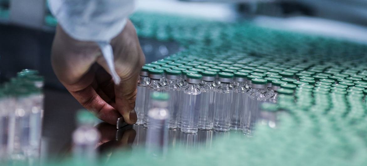 An employee works on the production line of a COVID-19 vaccine in India