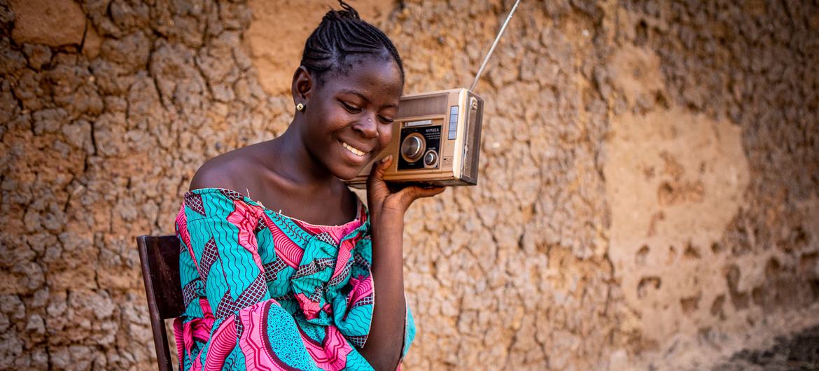 A ninth grade student follows her lessons on the radio in Mali. A ninth grade student follows her lessons on the radio in Mali.